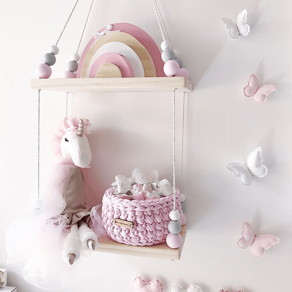 Hanging Wooden Shelf Decorated With Baby Toys