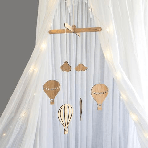 Bamboo Hot Air Balloon Mobile Hanging Under A White Cot Canopy